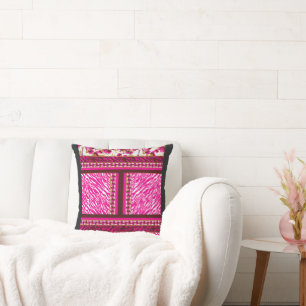 a pink and white wallpaper with a cross on it throw pillow