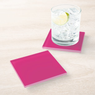 a pink background with a black border glass coaster