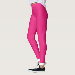 a pink background with a black border leggings