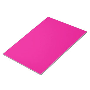 a pink background with a black border notepad