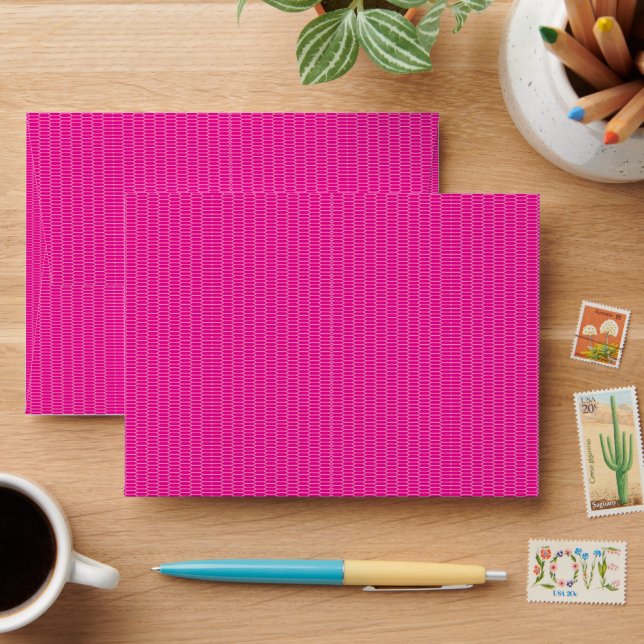 a pink background with a pattern of circles envelope (Desk)