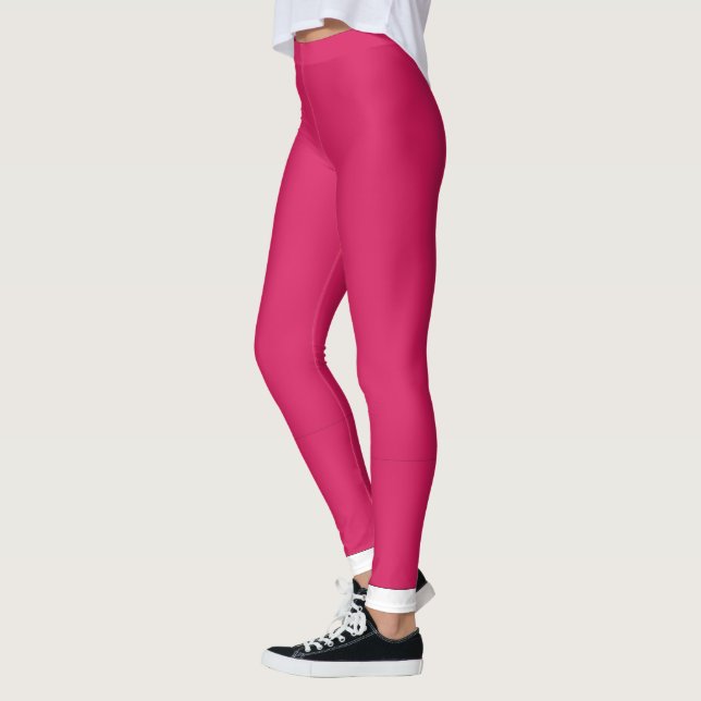 a pink background with a white border leggings (Left)