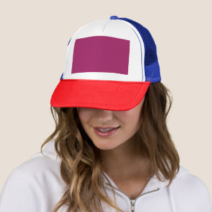 a pink background with a white border trucker hat
