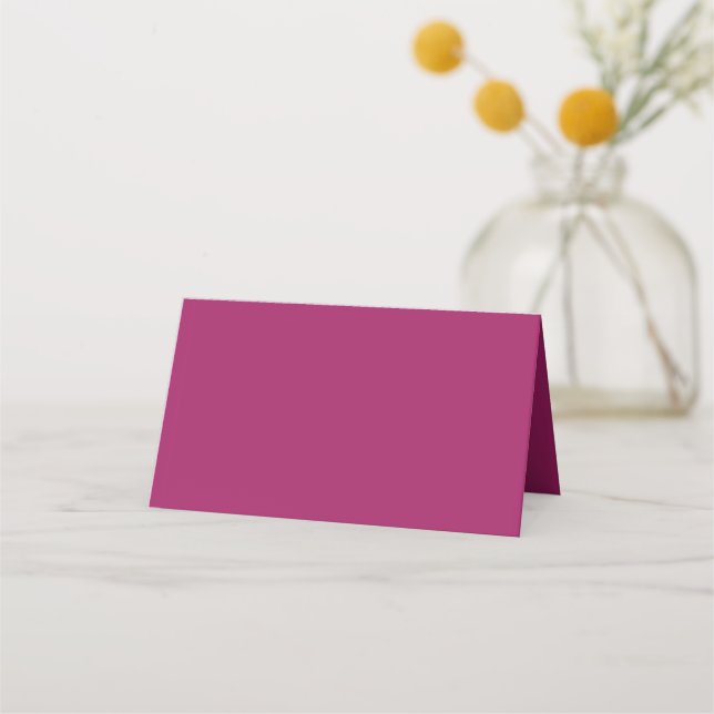 a pink background with a white place card (Front)