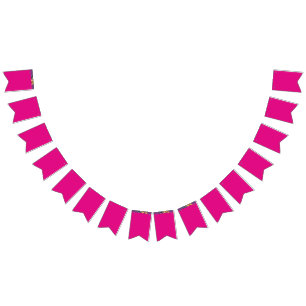 a pink background with white polka dots bunting flags