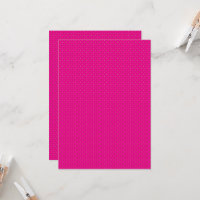 a pink background with white polka dots