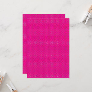 a pink background with white polka dots invitation