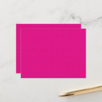 a pink background with white polka dots