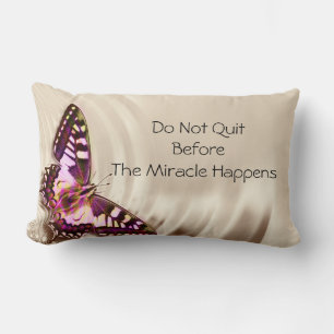 A pink butterfly on a cream satin background lumbar pillow