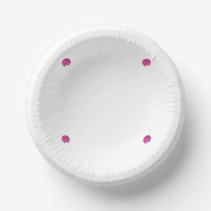 A pink flower with black spots on its petals, show paper plate
