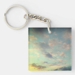 A pink to the clouds keychain