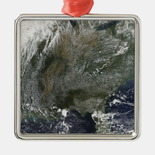 A pinwheel-like pattern of high pressure clouds metal ornament (Front)