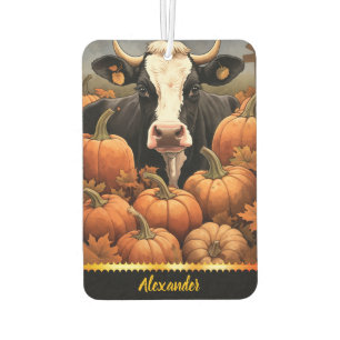 A playful cow amidst colourful pumpkins in autumn air freshener
