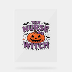 A playful design featuring a pumpkin witch with a acrylic sign