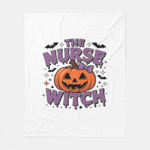 A playful design featuring a pumpkin witch with a  fleece blanket