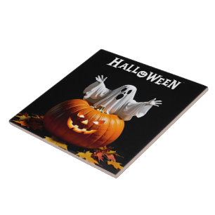 A playful ghost emerges from a carved pumpkin tile