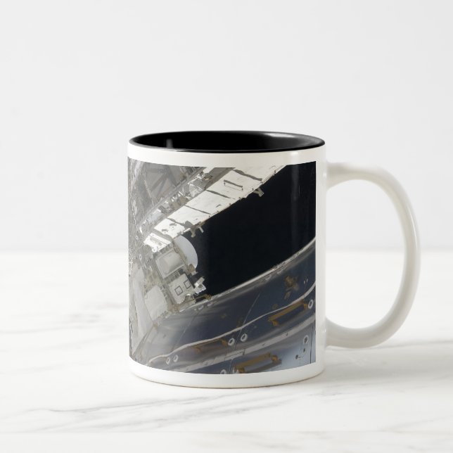 A portion of the International Space Station 3 Two-Tone Coffee Mug (Right)