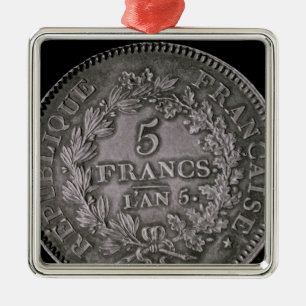 A pound of twenty sols metal ornament