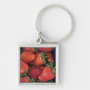 a punnet of ripe fresh strawberries for sale in keychain