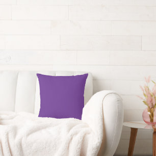 a purple background with a throw pillow
