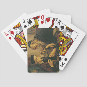 A Rabbi tying the Phylacteries to the arm of a boy Playing Cards