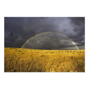 A rainbow appearing through a misty after noon photo print