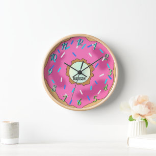 A rainbow of colors, a pink donut with a name for  clock
