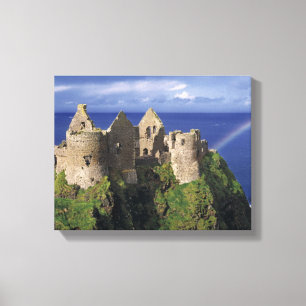 A rainbow strikes medieval Dunluce Castle on Canvas Print