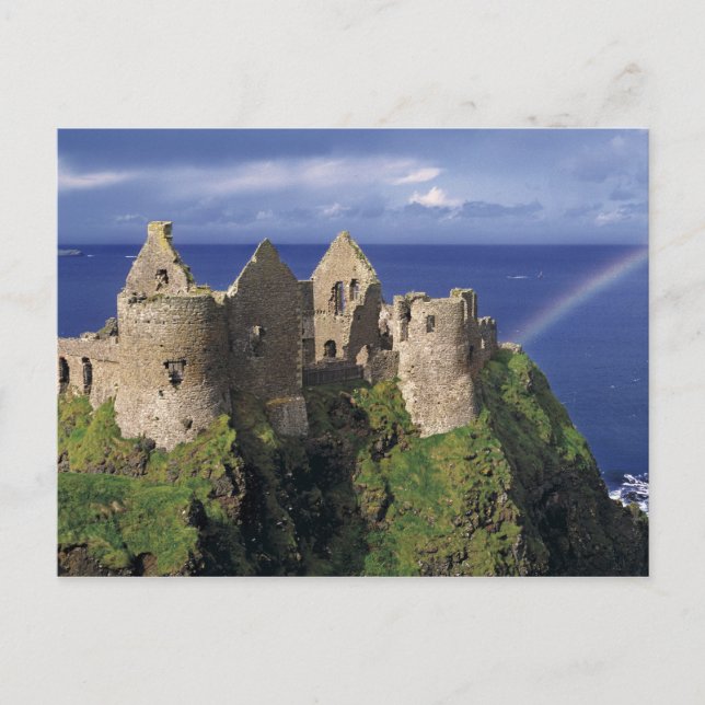 A rainbow strikes medieval Dunluce Castle on Postcard (Front)