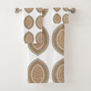 A rectangular rug with an intricate geometric moti bath towel set