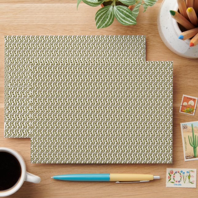 A rectangular rug with intricate geometric pattern envelope (Desk)