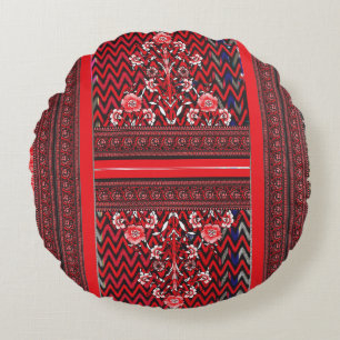 a red and black painting with a red heart on it round pillow