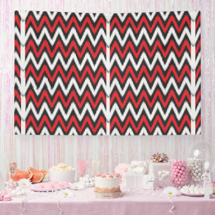 a red and black zigzag pattern on a white backgrou banner