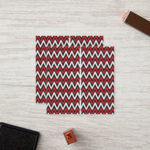 a red and black zigzag pattern on a white backgrou loyalty card