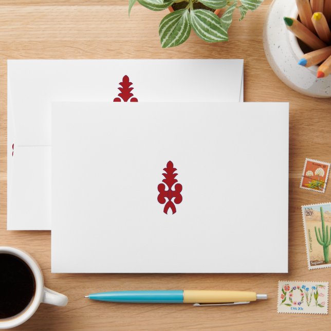 a red and blue pattern on a white background envelope (Desk)