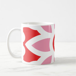 a red and white pattern with a flower on it coffee mug