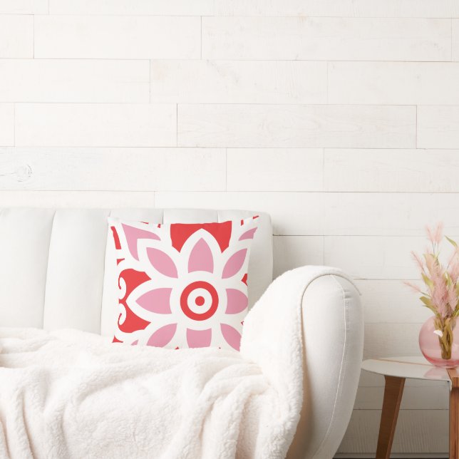 a red and white pattern with a flower on it throw pillow (Couch)
