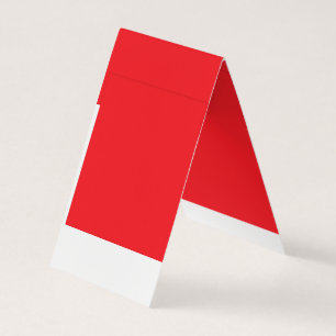a red background with a white border business card