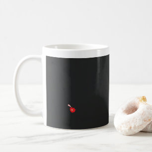 a red flower with a black background coffee mug