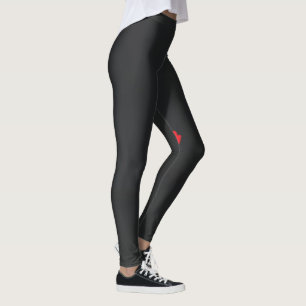 a red flower with a black background leggings