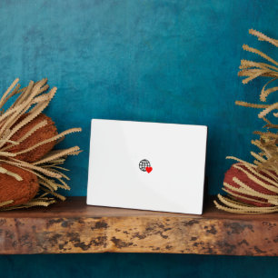 A red heart symbol created with smooth, bold lines plaque