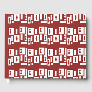 A red rug with a textured pattern is spread out on guest book