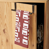 A red rug with a textured pattern is spread out on