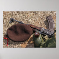 A rifle, military cover and canteen