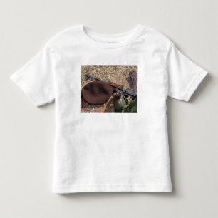 A rifle, military cover and canteen toddler t-shirt