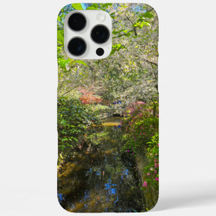 a river in the garden surrounded by flowers iPhone 16 pro max case