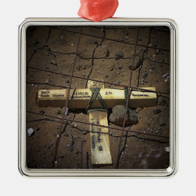 A road repair crew places a cross metal ornament (Front)