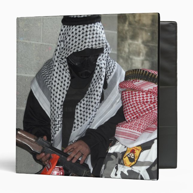 A role-playing enemy aggressor arms a dummy binder (Front/Inside)