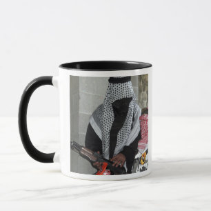 A role-playing enemy aggressor arms a dummy mug