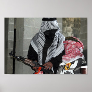 A role-playing enemy aggressor arms a dummy poster